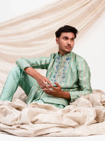 The fluid drape of the fabric is evident in this artistic shot of the mint green kurta, a piece that combines modern aesthetics with traditional comfort.
