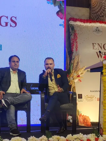 In the middle of a panel discussion, sharing my insights on modern wedding trends and the future of the industry.