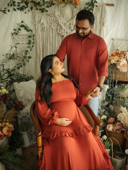 A romantic portrait of a couple sharing a loving gaze. This shot perfectly captures the connection and shared excitement of the parents-to-be.