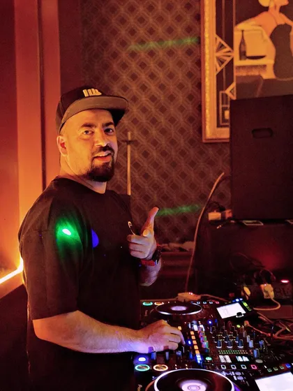 Giving a thumbs up from the DJ booth at 10SpeakEasy.