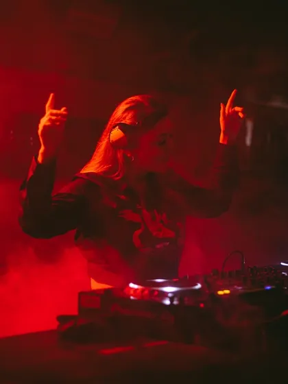 Rocking out behind the decks. It's not just about playing music, it's about performing and bringing the energy.