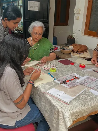 Guiding students during a Kasuti workshop. I enjoy helping each person with their technique, ensuring they feel supported as they learn.