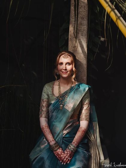 A duplicate of 204, this portrait showcases the bride's serene beauty and her elegant henna.