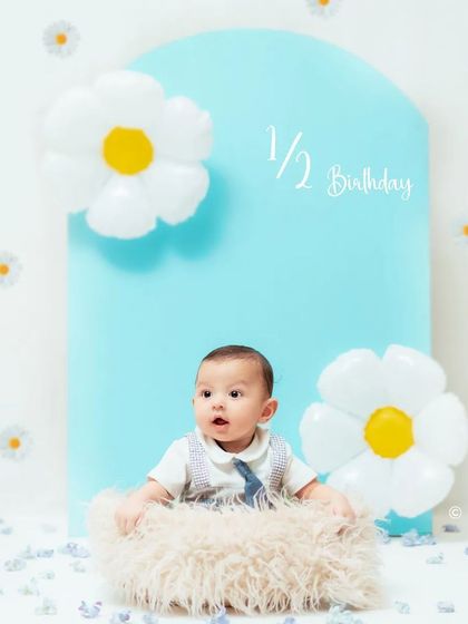 Celebrating a half birthday! This simple and modern setup with balloon flowers is perfect for marking the six-month milestone.