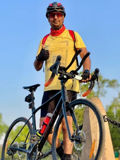 A member with his specialized bike, giving a thumbs up. We appreciate good engineering and good photography.