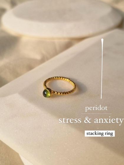 This is my Peridot stacking ring, a small but mighty tool for managing stress and anxiety.
