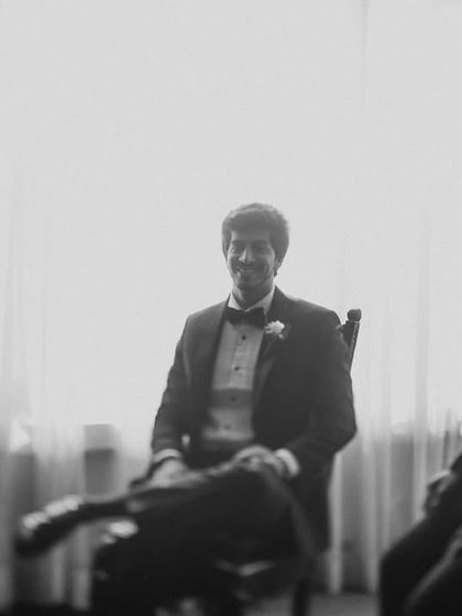 The groom and his groomsmen in a quiet moment before the church ceremony. The black and white treatment adds a timeless, classic feel.