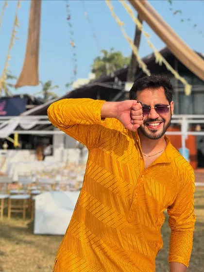 A playful, energetic pose at a Haldi. This is the kind of 'bindaas' attitude I bring to make your event lively.