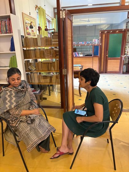 Another quiet moment of connection between two attendees. Our space offers many nooks for personal conversations.