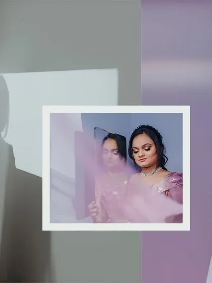 An abstract bridal portrait using a mirror and a sheer cloth to create layers and a dreamy, ethereal quality.