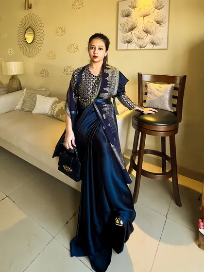 This look is my tribute to the art of Indian fashion. I've styled this deep blue saree with a brocade blouse and a Kashmiri shawl, using an Afghan necklace as a belt to create a powerful, unconventional fusion look.