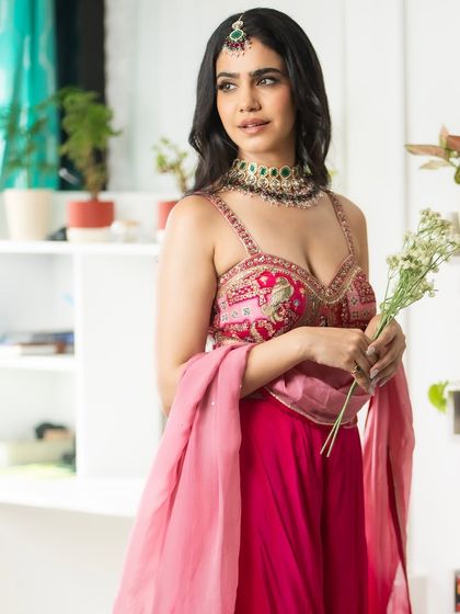 A final shot of my festive look. The combination of pink, intricate embroidery, and traditional jewellery is timeless.