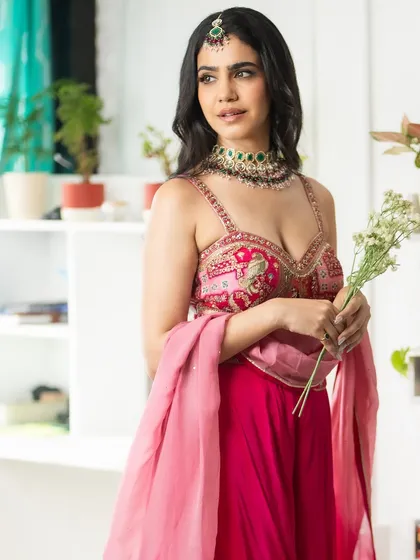 A final shot of my festive look. The combination of pink, intricate embroidery, and traditional jewellery is timeless.