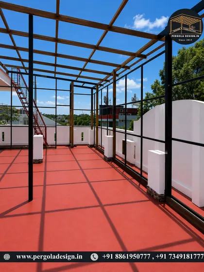 This view shows the full length of the rooftop pergola frame, including the integrated staircase access.