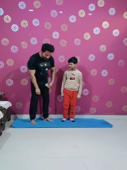 A light-hearted moment during a kids' yoga session. Making fitness fun is the best way to build lifelong healthy habits.