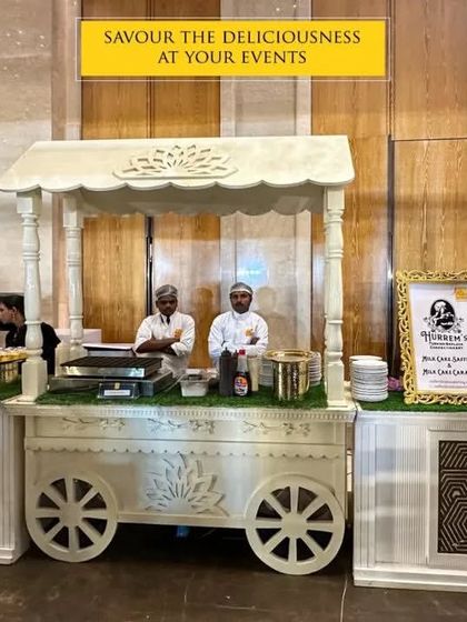 Savor the deliciousness at your events with our charming food carts. This white, intricately designed cart serves as a unique and elegant station for desserts or appetizers, adding a whimsical touch to the buffet.