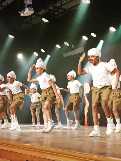 A close-up of the kids' Bhangra performance. The smiles on their faces show how much they enjoy learning and performing these powerful, celebratory dances.