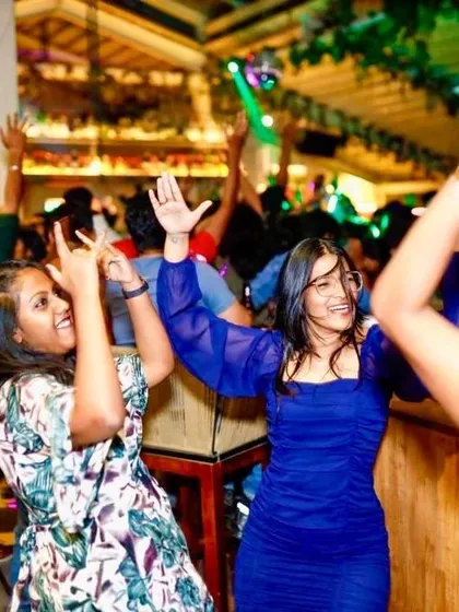 The energy is infectious as guests dance with their hands in the air.