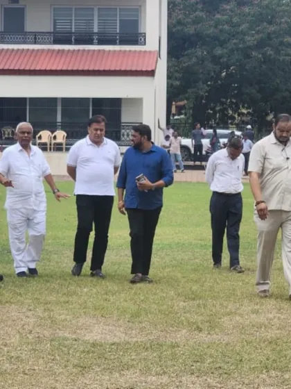 A candid moment on the field with the guests and officials during the tournament.