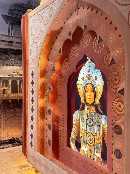 A detail from the 'Indofuturism' installation, where a futuristic portrait is framed by a felt-and-embroidered 'Mahal' archway. This deliberate juxtaposition of the digital and the handcrafted is central to our exploration of India's emerging visual culture.