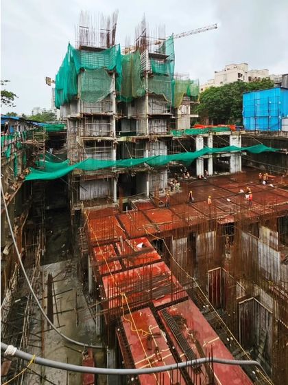 A view of the Runwal Timeless project during the early stages of construction. This image shows the scale of the undertaking and the complex groundwork required for a high-rise development.