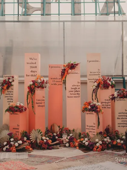 Your love story, told through decor. For this Haldi, we created these bespoke 'Promise Pillars', a unique photobooth where the couple's sweet and funny promises to each other became the main attraction.