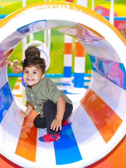 This little one is exploring the toddler-friendly crawl tunnel in our 'My Burrow' section, designed specifically for children aged 2 to 4.