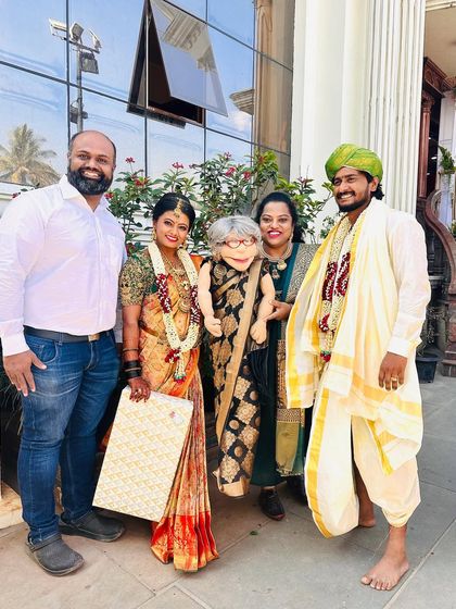 A picture with the happy couple. It's a joy to bring my puppet family to celebrate the personal milestones of my friends.