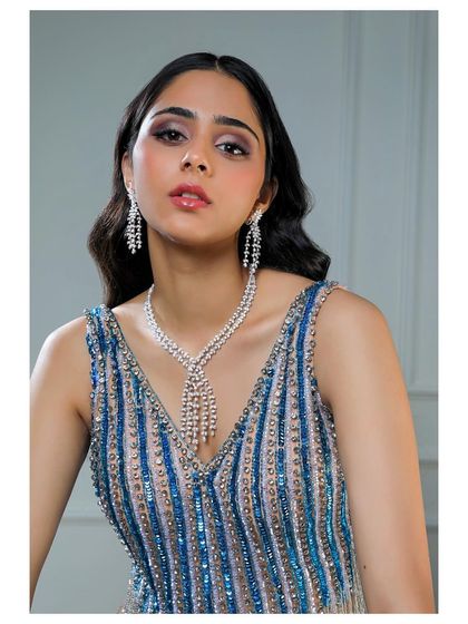 This shot from a diamond jewellery campaign features a cascading lariat necklace and matching earrings. I styled it with a sequined blue gown to create a glamorous, red-carpet-ready look that emphasizes the brilliance of the stones.