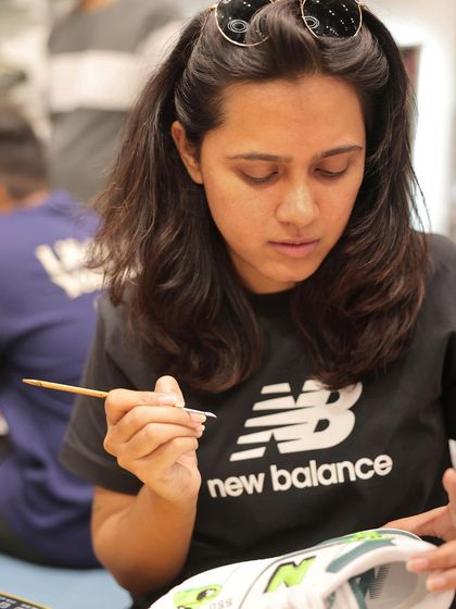 A close-up shot of me getting into the zone at the New Balance event. Every custom piece requires focus and a steady hand to get the details just right, whether it's a logo, a character, or a complex pattern.