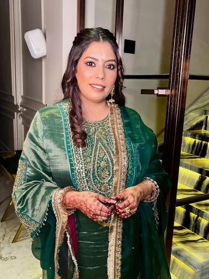 Skin first, makeup second, confidence always. A beautiful, natural look for this guest in a stunning green suit.