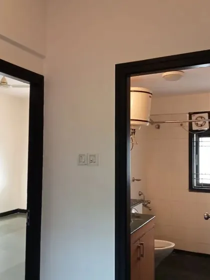 For a bold, modern aesthetic, I painted these door frames in a matte black finish, creating a sharp contrast with the clean white walls of the home.