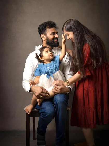 It's the unposed, in-between moments that I love the most. This candid family portrait captures a genuine interaction, showing the playful and loving bond that makes your family special.