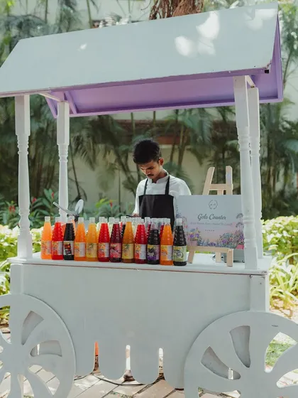 A vintage-style cart set up as a 'Gola' station, offering a nostalgic and colorful treat for guests of all ages.