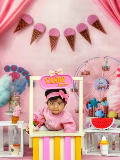 A full view of our sweet and colorful candy shop theme, featuring a candy stall, ice cream props, and a Ferris wheel.