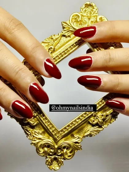 A flawless set of classic red gel nails, shaped into a perfect almond style. This timeless and elegant look is one of our most requested services, ideal for any occasion that calls for a touch of sophistication.