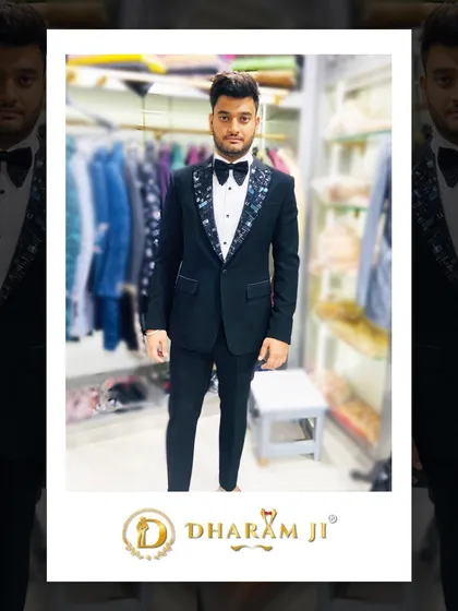 A client looking sharp in a black tuxedo with patterned lapels. He looks ready for his big event.