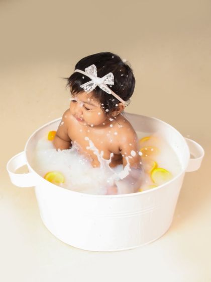 Another fun splash in the tub! I love capturing the movement and joy of these milk bath photography sessions.