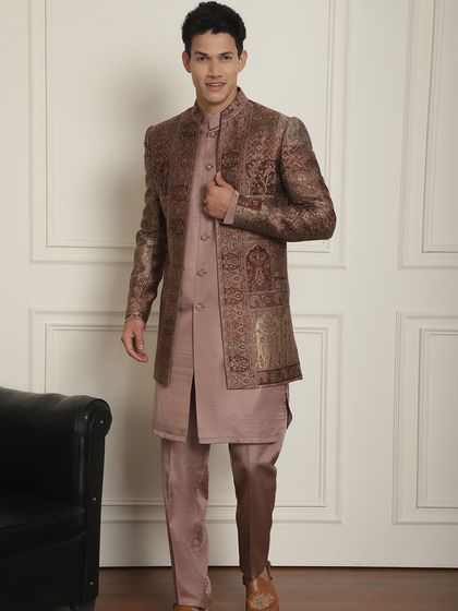 The magic of summer romance and weddings. This brown patterned Indo-Western jacket paired with a mauve kurta is cool, stylish, and perfect for a Sagai or Sangeet.