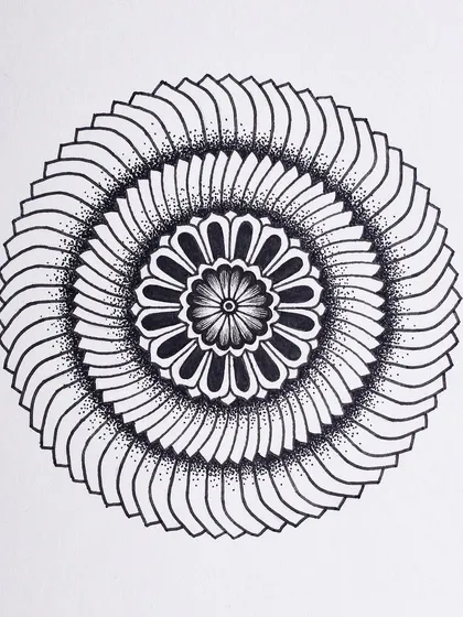 Two small mandalas from my Inktober series. The top one has a layered, blade-like pattern, while the bottom one features a softer, floral design.