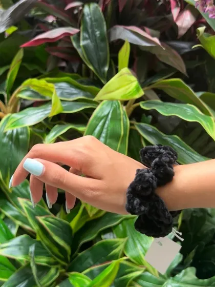 The black velvet scrunchie is a timeless classic. It’s a staple accessory that’s both practical and stylish, handmade with soft, high quality yarn.