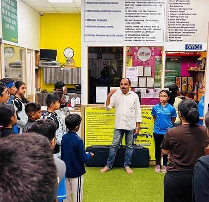 A wide view of our academy in Hulimavu, where I am addressing a group of aspiring shooters. This is where dreams take flight.