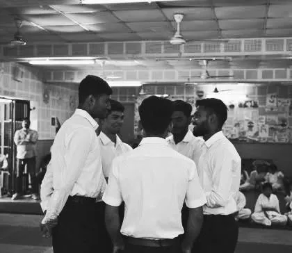 A huddle of our senior members and coaches, strategizing and motivating each other. Teamwork is at the heart of everything we do.