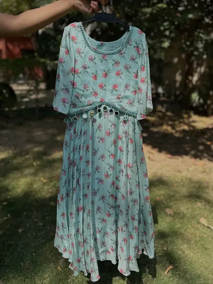 The aqua blue version of my floral dress with a mirror-work belt. A cool and refreshing color for a summer event.