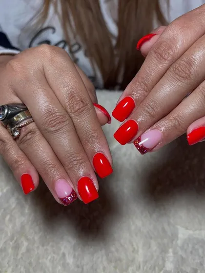 A fun and playful set with a mix of bright red and a sparkling pink glitter accent nail.
