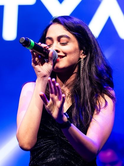 A close-up shot from a concert, completely lost in the song. This passion is what I bring to every performance.