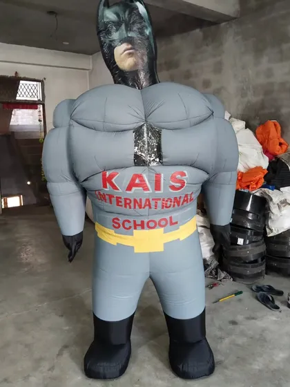 The Dark Knight comes to life as a large inflatable mascot. This Batman costume was customized for an international school event.