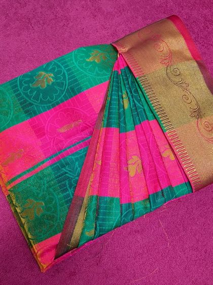 A different angle of the box-folded saree, showing how the pallu is neatly wrapped around.