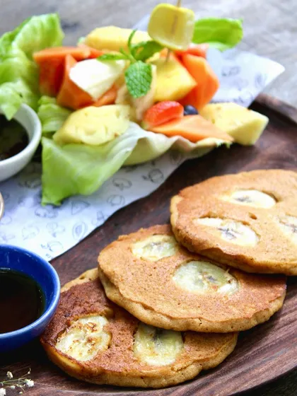 Our pancakes are impossibly fluffy and served with fresh fruit and maple syrup. It's not just a meal; it's a mouthwatering journey to pancake perfection.