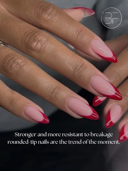 A bold red French tip on a perfectly shaped almond nail. This look is strong, confident, and incredibly chic.